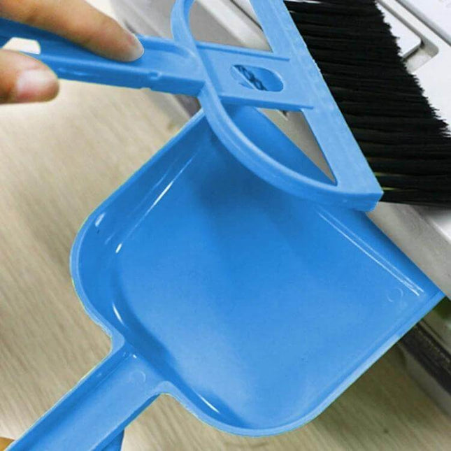Mini Desktop and Car Cleaning Brush Dustpan Set in Assorted Colors compact blue brush and dustpan cleaning a desk surface