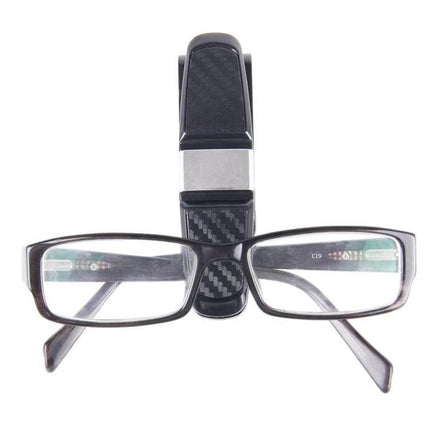 Liwen Foldable Car Headrest Tray for Meals and Beverages shown folded holding eyeglasses to illustrate compact storage and portability