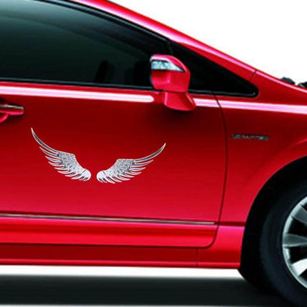 Elegant Silver Angel Wing 3D Metal Sticker for Car Decoration applied to red car door, durable weather‑resistant metal decal for hood, doors, bumpers
