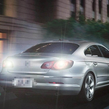 Dual Color LED Car Brake and Turn Signal Light For 12V installed on rear of silver sedan showing bright dual-color brake and turn illumination