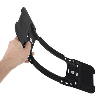 Black Rear License Plate Bracket for Secure Car Mounting — matte black plastic bracket held by hand for rear bumper mounting, adjustable fit