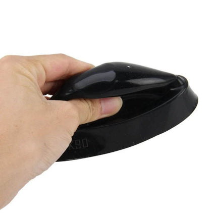 K90 Universal Car Headlight Dust Covers, Silicone Seal Caps 9cm in black silicone being stretched by hand to show flexibility and fit