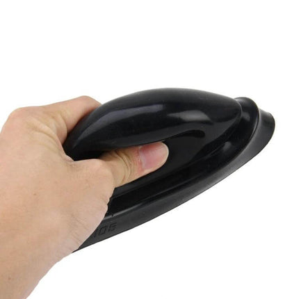 Universal Car Headlight Silicone Dust Cover 2 Pack - black silicone bulb seal cap shown squeezed by hand, protects headlights and fog lights from dust and moisture