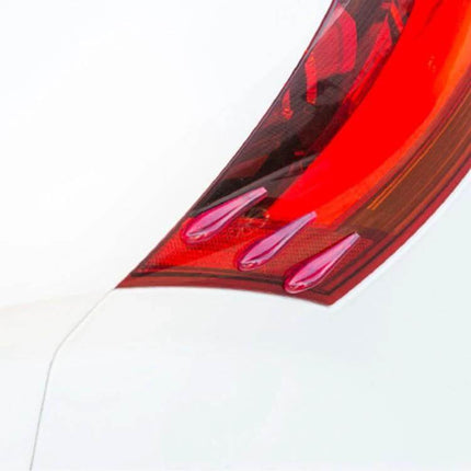 Universal Acrylic Resin Rear Spoiler for Car Protection and Decoration installed over a red rear light edge to guard against scratches and minor impacts