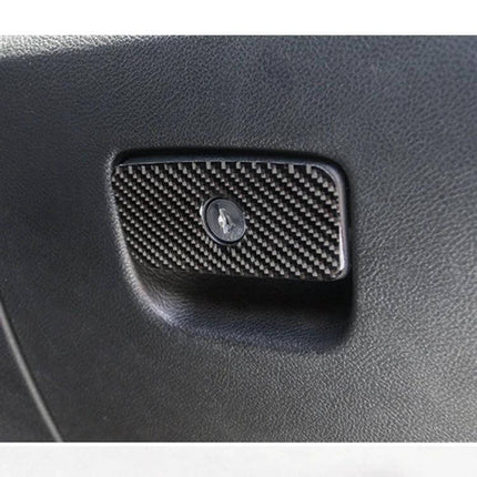 Carbon Fiber Front Passenger Storage Box for Jeep Grand Cherokee installed on black interior panel, carbon fiber texture and lock detail