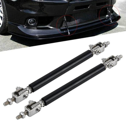 Car Lip Support Rods 2 Pack Telescopic Front And Rear Bars installed on a car front lip, adjustable black telescopic support rods