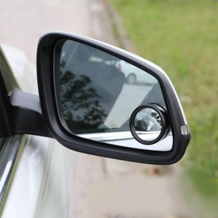 Wide Angle Blind Spot Mirrors for Cars and Trucks, 2 Pack — round stick-on mirror on car side mirror showing expanded view to reduce blind spots