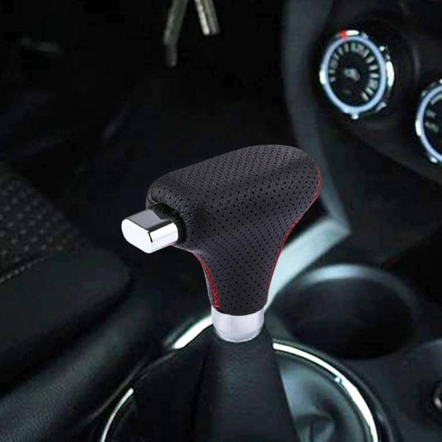 Black Leather Universal Gear Shift Knob Cover for Cars and Trucks installed on car shift lever, black perforated PU leather with red stitching