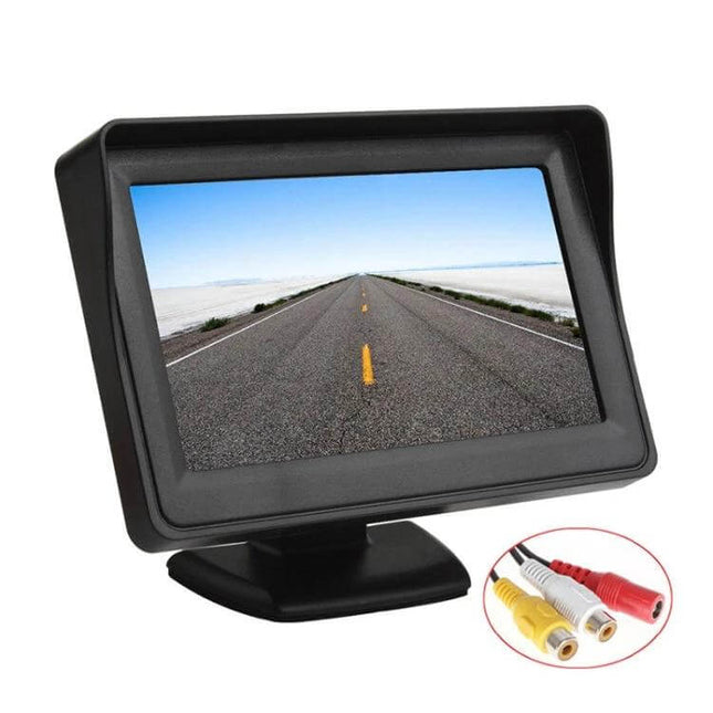 4.3-Inch LCD Car Rearview Monitor with Stand and Shade showing road view on 4.3-inch TFT screen with sun shade and RCA cables