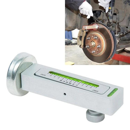 Essential Tool for Home Car Wheel Alignment Checks - magnetic camber caster gauge attached to brake disc for DIY alignment verification