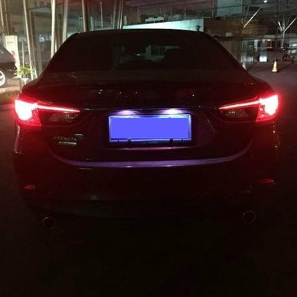 1157 Bay15D LED Car Brake Light Bulbs 22LED For Easy Plug And Play installed on a sedan showing bright rear brake illumination at night