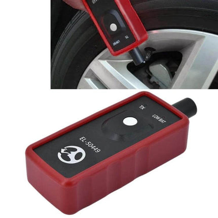 Tire Pressure Monitoring Sensor for Ford Vehicle Safety Systems - red TPMS reset tool used on Ford wheel valve