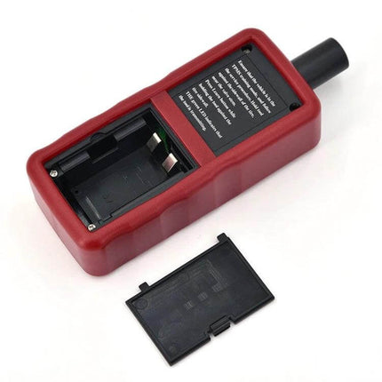 Tire Pressure Monitoring Sensor for Ford Vehicle Safety Systems - red sensor reset tool with battery compartment shown