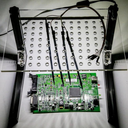 Practical LED Frame for Everyday Vehicle Maintenance Projects with acrylic board holding probes over an ECU circuit board for chip tuning