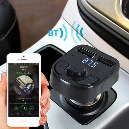 X8 Car MP3 Wireless FM Transmitter With Digital Display plugged into car cigarette lighter showing 87.5 frequency and USB ports