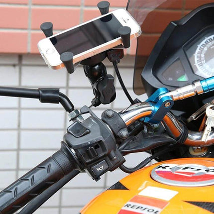 12V Motorcycle USB Phone Charger with Holder for Smartphones mounted on motorcycle handlebar holding smartphone and charging via USB cable