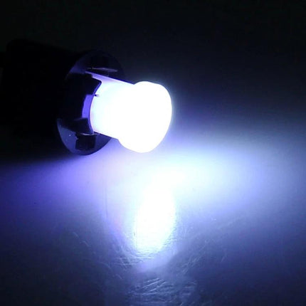 Car Interior LED COB Bulbs Ice Blue Light Reading Lamp glowing ice blue COB LED bulb installed in car interior providing soft reading light