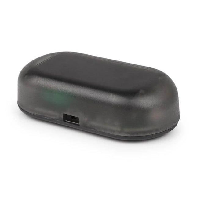 LQ-S10 Car Solar Dummy Alarm Light Blue Flashing Security Lamp mounted on car roof showing compact black dome housing and LED sensor