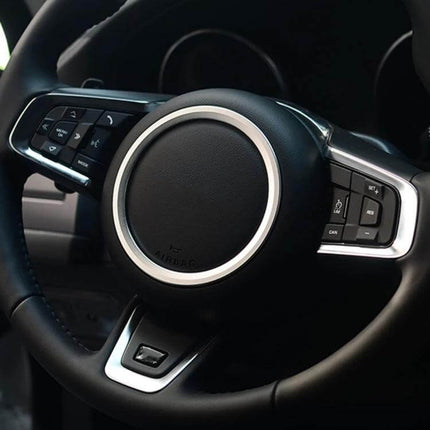 Aluminum Alloy Steering Wheel Trim Decoration for Jaguar Cars installed on black Jaguar steering wheel, sleek interior upgrade
