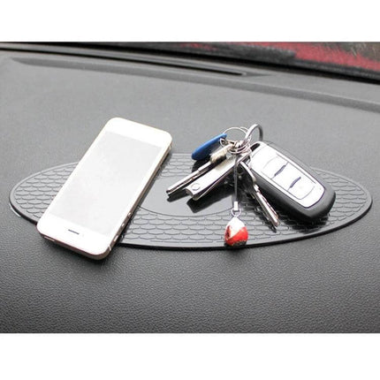 30x9.5cm Oval Rubber Anti-Slip Mat for Car Dashboard Devices holding phone keys and sunglasses on a car dashboard