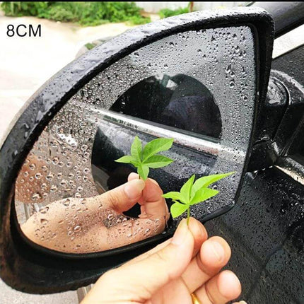Clear Anti-Fog Protective Film for Car Rearview Mirrors, 8cm Diameter on wet side mirror showing clear circular PET film reducing fog and glare