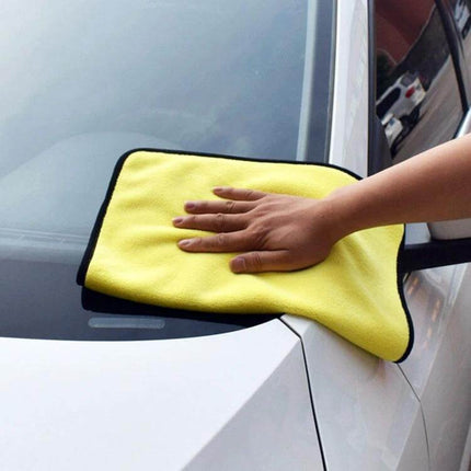 Microfiber Cloth for Car Washing and Drying, 30x30cm being used to gently dry a car windshield and painted surface