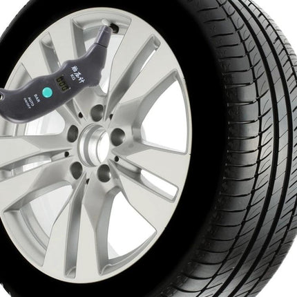 Rosh Tire Gauge for Routine Vehicle Maintenance Checks showing gauge measuring tire pressure on car wheel with LCD display