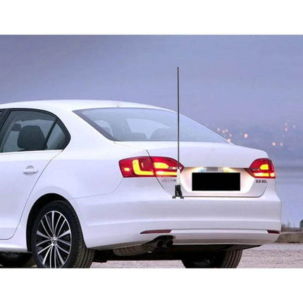 105cm Long Car Antenna Aerial for Radio Reception mounted on rear of white sedan to improve AM/FM reception