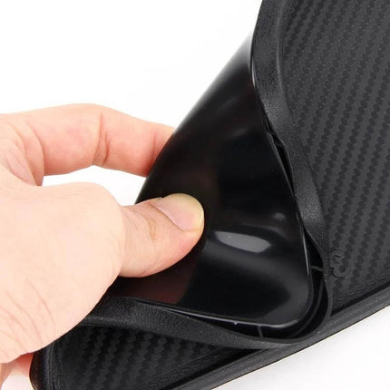 Multi-Purpose Car Dashboard Anti-Slip Mat for Securing Devices being peeled to show non-slip surface holding phone and sunglasses securely