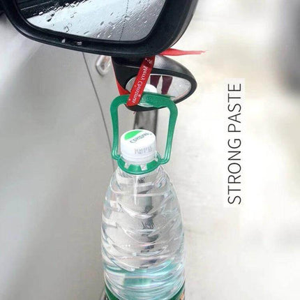 Right Side Blind Spot Assistant Mirror for Cars in Black and White mounted on lower left mirror showing added visibility and strong paste holding a bottle