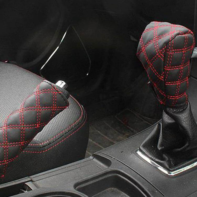 Red and White Car Hand Brake Shift Knob Cover Set showing red-stitched black covers on hand brake and gear shift in car interior