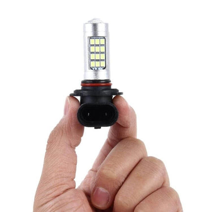 2-Pack LED Car Fog Lights for Clear Night Visibility - hand holding slim LED fog bulb with adjustable bracket and dual bulbs