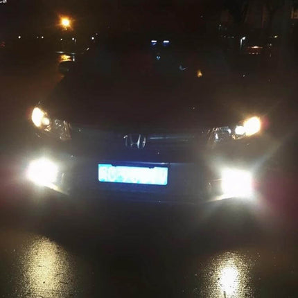 2-Pack LED Car Fog Lights for Clear Night Visibility on a parked sedan showing bright front fog illumination