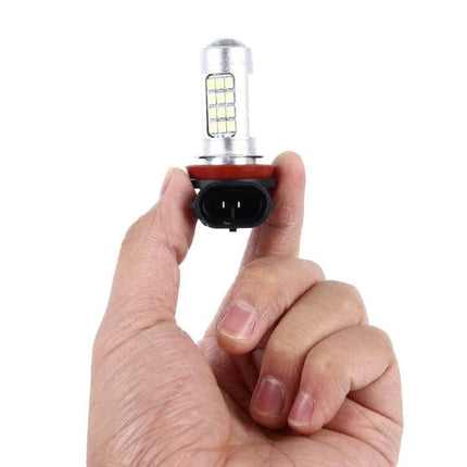 LED Car Fog Lights 2 Pack For Foggy Nights For Cars - slim LED fog light bulb held in hand with adjustable bracket and bright white LEDs