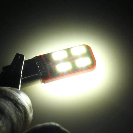 BA9S LED Car Clearance Light White Easy Install For Vehicles - glowing replacement LED in hand showing bright white beam