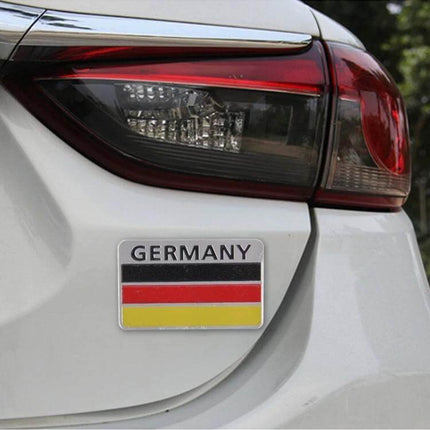 Germany Flag Style Metal Car Sticker for Vehicle Protection on white car trunk near taillight, metal scratch guard with German flag design