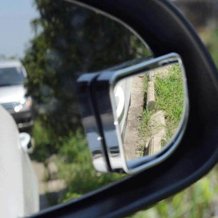 2 Pack Wide Angle Car Blind Spot Rear View Mirrors for Safer Driving - close-up of small wide-angle mirror attached to car side mirror showing expanded road view