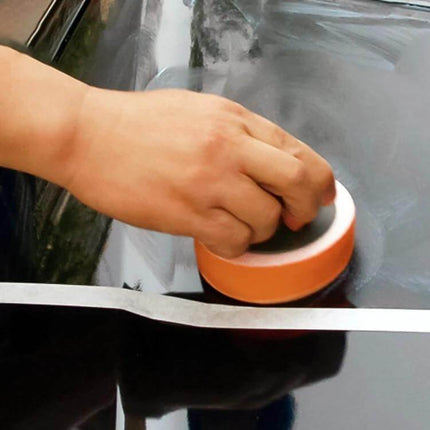 Round High-Density Car Polishing Sponge for Vehicle Cleaning gently buffing a car hood after washing to achieve a smooth finish