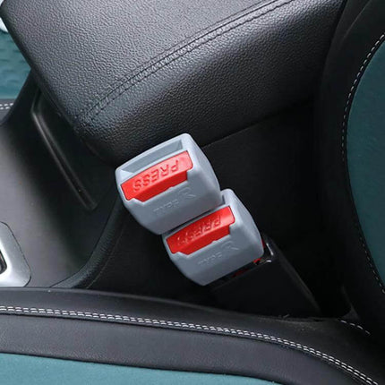 Universal Black Car Seat Belt Extension Buckle, 2 Pack showing two grey-and-red buckle extenders installed beside a car seat for added comfort and reach