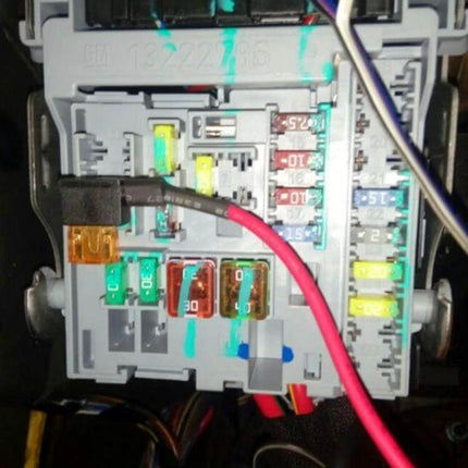 Car 12V Add-A-Circuit TAP Adapter For Extra Fused Circuits Mini Size installed in vehicle fuse box with red tap wire