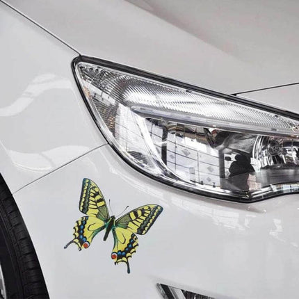 Set of 7 Butterfly Design Car Stickers for Vehicle Decoration applied on white sedan near headlight