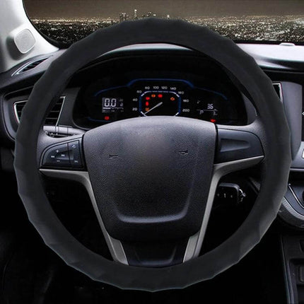 Universal Rubber Steering Wheel Cover with Distorted Lines Texture fitted on car steering wheel for improved grip and protection