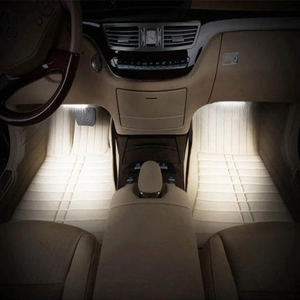 Car Interior LED Floor Light RGB Mood Lamp For Dash And Floor glowing white under front seats creating ambient footwell lighting