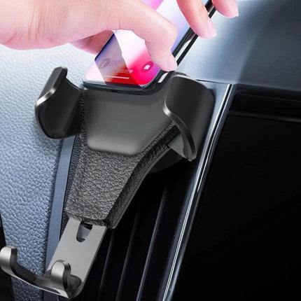 Gravity Car Mount Phone Holder with Litchi Texture Design showing automatic gravity locking on a car vent for hands-free navigation