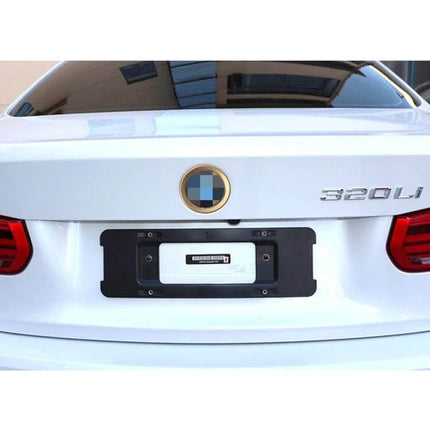 BMW 3 Series Steering Wheel Emblem Decoration Ring installed on white BMW trunk showing gold emblem ring detail