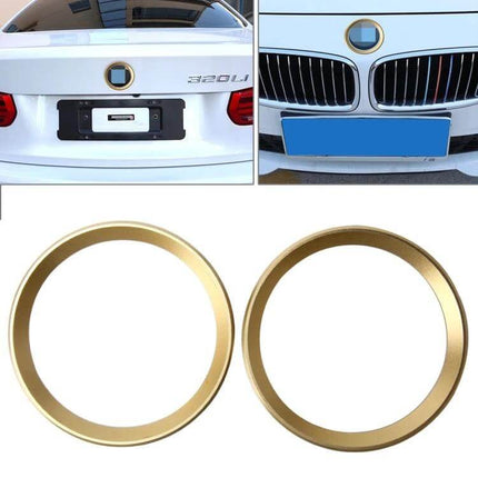 BMW 5 Series Decorative Steering Wheel Logo Ring gold trim shown on front and rear emblem for interior exterior styling