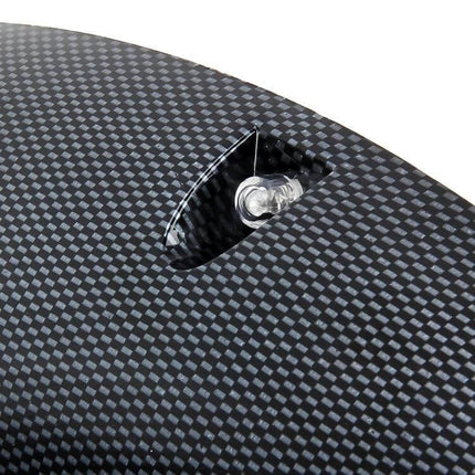 Universal Black Rubber Fender Flare Stickers, 58cm Long on carbon-look surface showing close-up of textured rubber and mounting detail