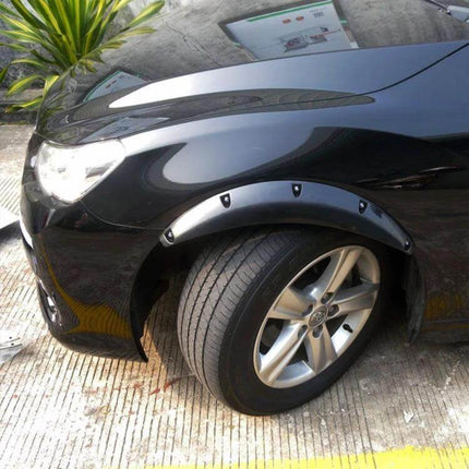 Universal Black Rubber Fender Flare Stickers, 58cm Long installed on black car wheel arch protecting paint from debris