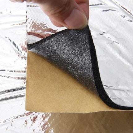 Car Engine Heat and Sound Insulation Mat with Adhesive, 1m x 1.4m Size - hand peeling backing from adhesive insulation mat showing foil and foam layers