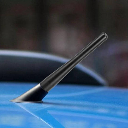 Compact 10cm Car Antenna for Enhanced Radio Reception mounted on blue car roof, low-profile 1.5x10cm AM/FM antenna for improved signal